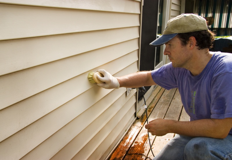 man installing siding